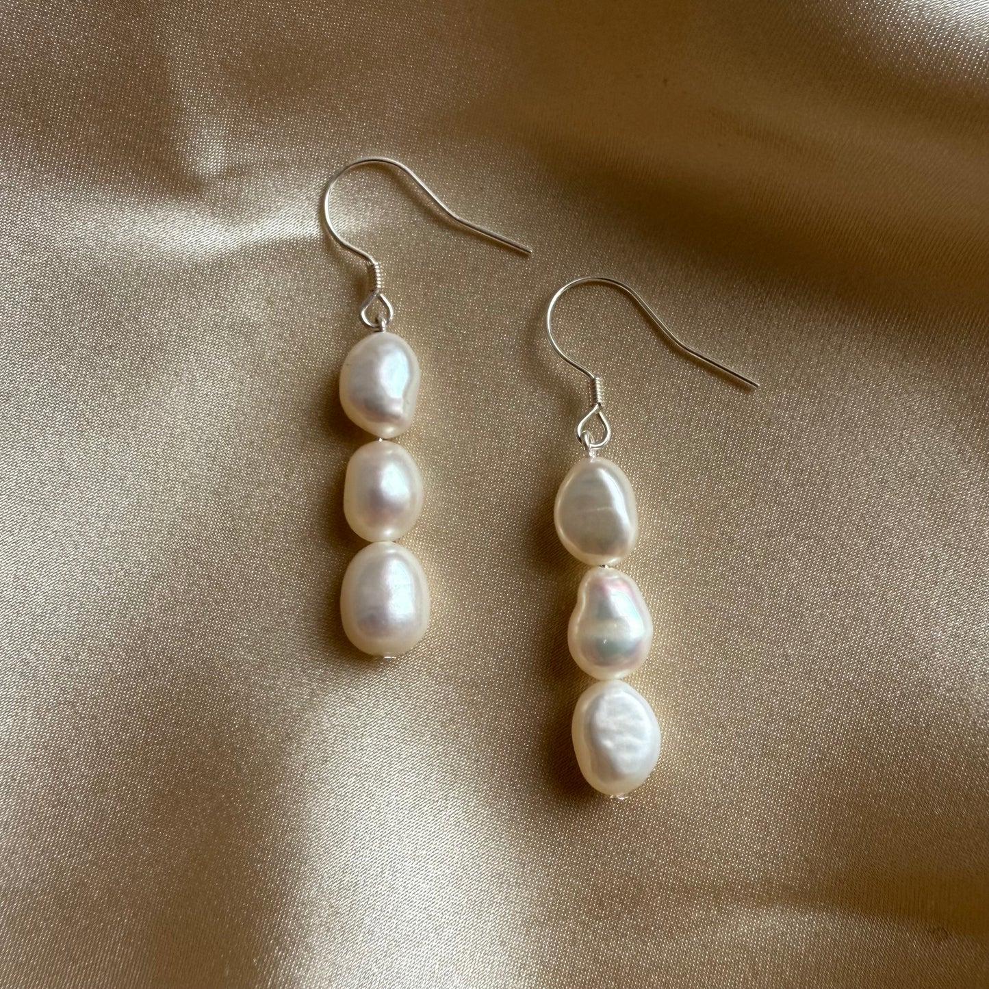 Three baroque pearl drop hook earrings
