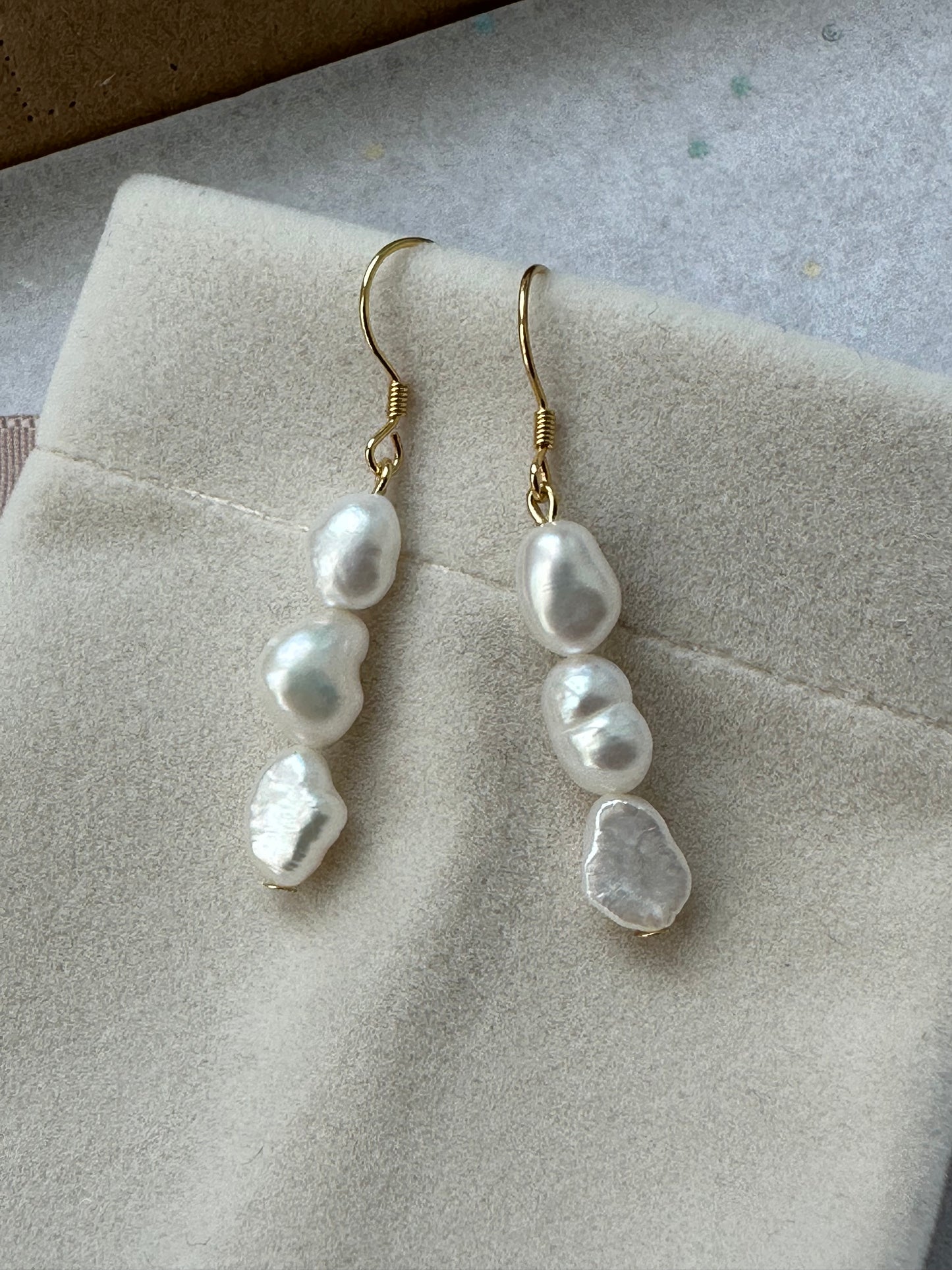 Three baroque pearl drop hook earrings