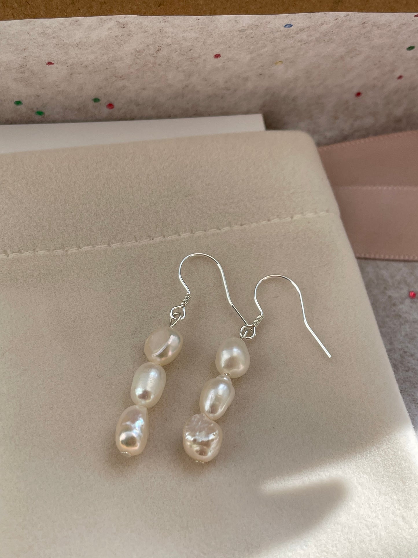 Three baroque pearl drop hook earrings